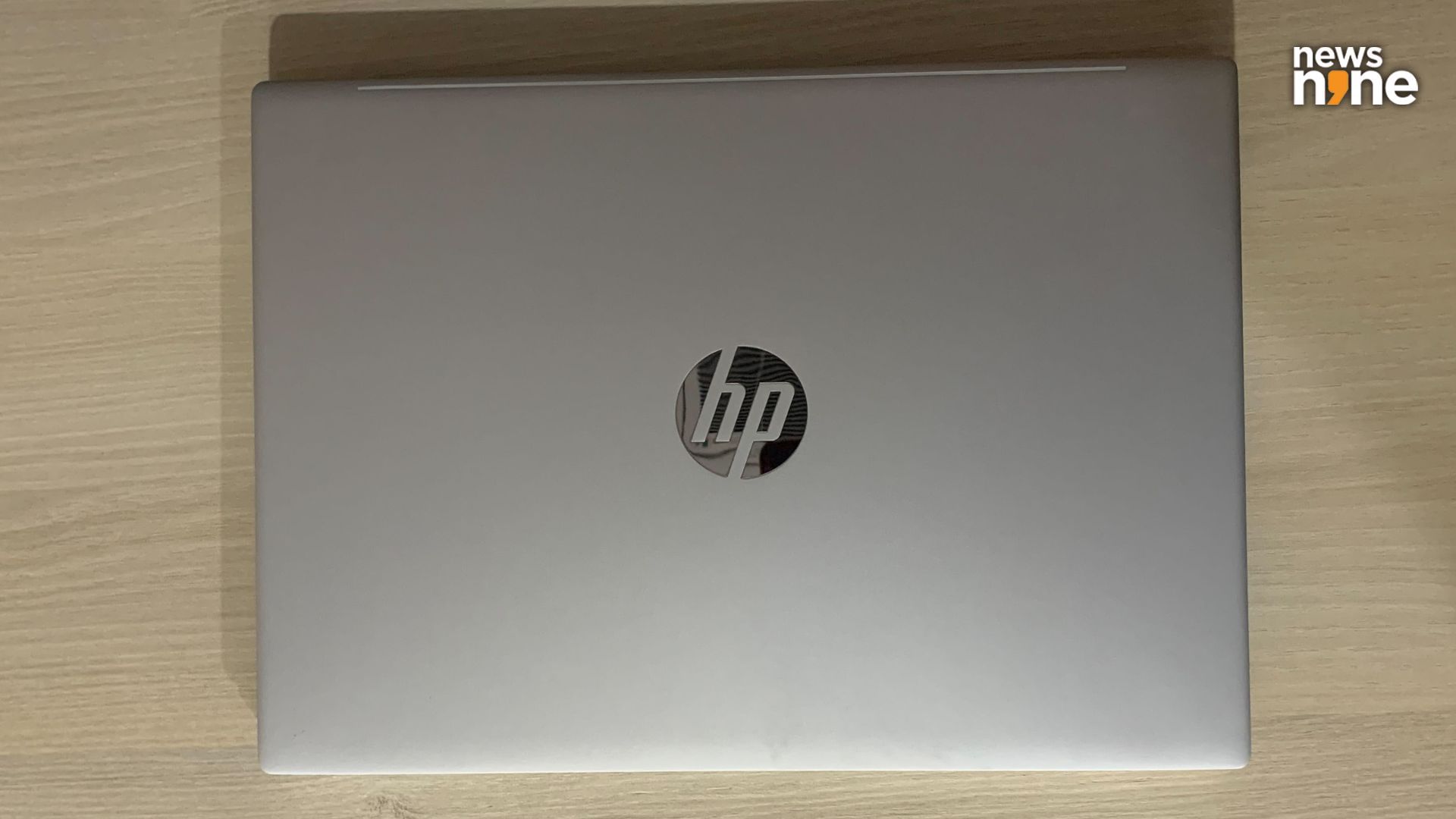 The HP logo on the lid is shiny. (Image Credit: Aditya Madanapalle/News9).