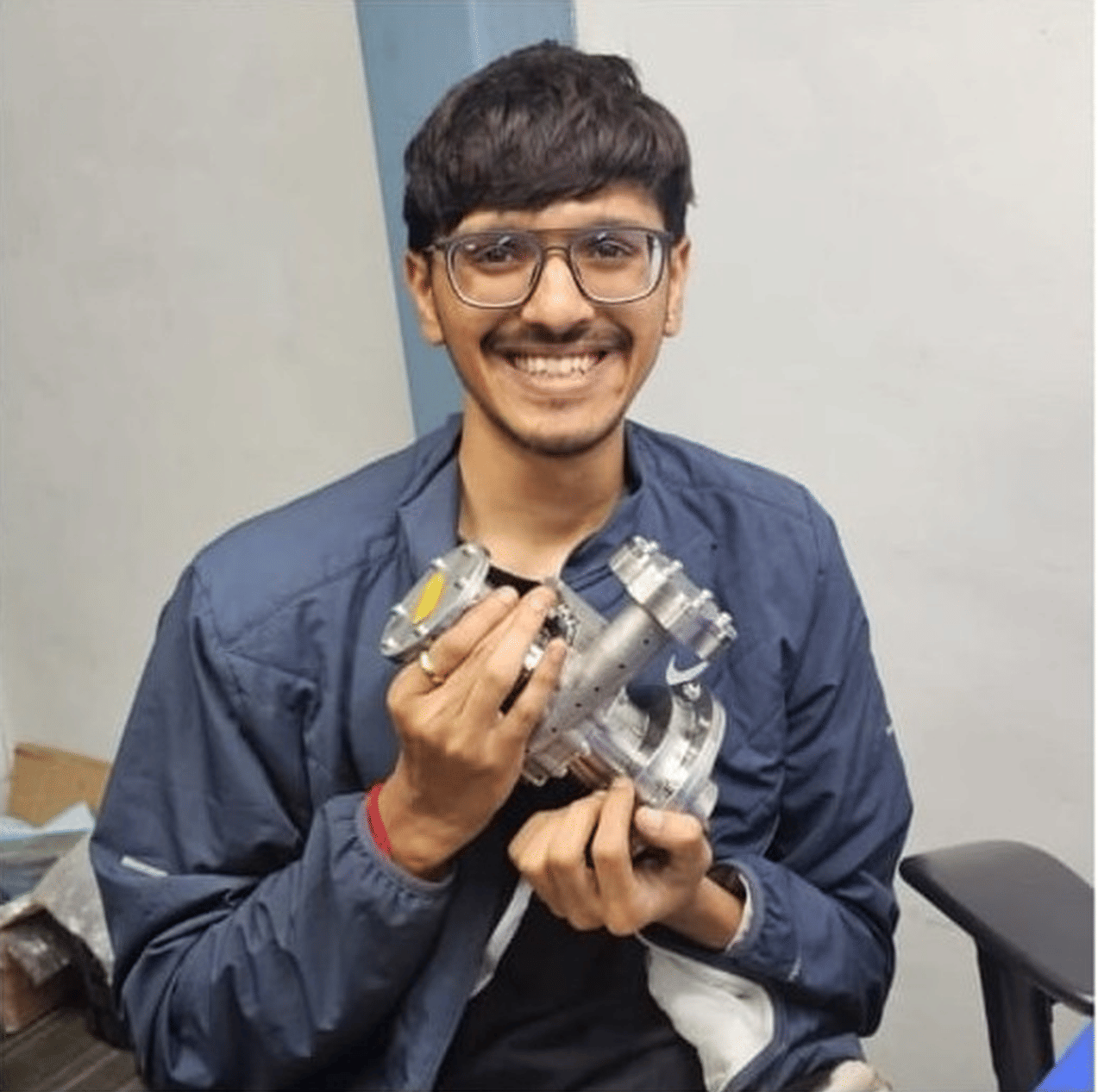 Suyash Bafna, cofounder of Astrophel Aerospace with the indigenously developed cryo-pump. (Image Credit: Astrophel Aerospace). 