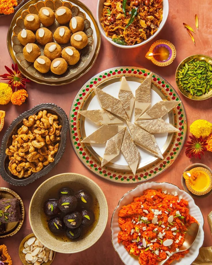 This may contain: a table topped with plates and bowls filled with different types of food next to each other