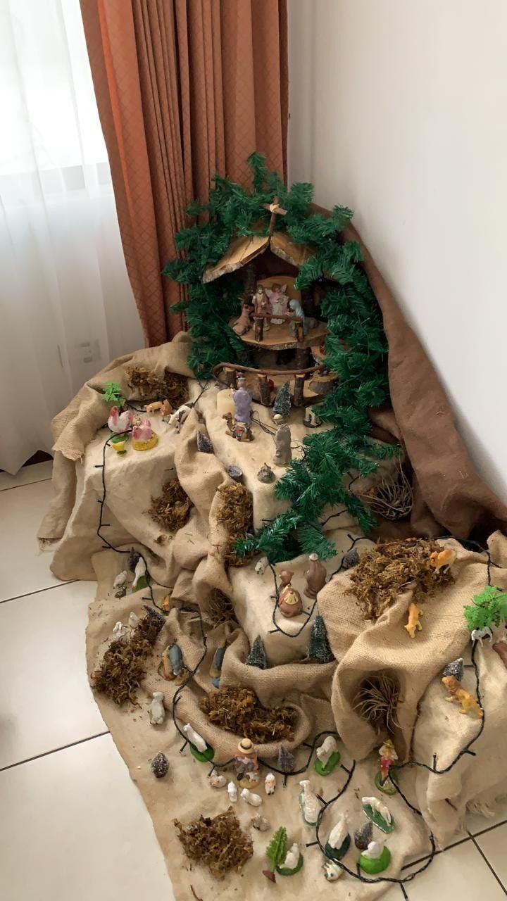 This may contain: a nativity scene is displayed on the floor