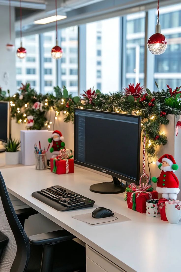This contains: Modern office desks decorated with garlands, red ornaments, fairy lights, and small Christmas gifts, creating a festive holiday atmosphere in a bright workspace.
