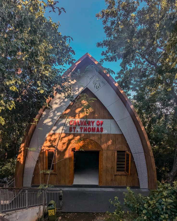 This may contain: a large wooden building with a sign on it's front door that says no way to hang off