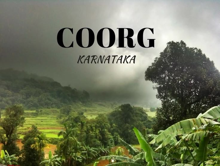 This may contain: the words coorgg karnattaka surrounded by lush green trees and mountains