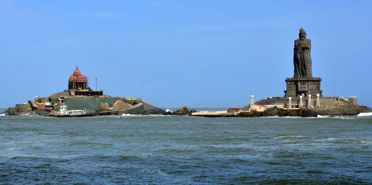 This may contain: an island in the middle of the ocean with a lighthouse on one side and a tower on the other