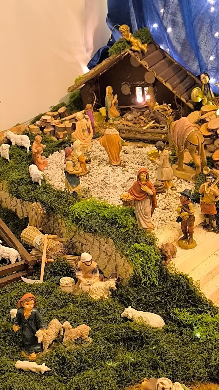 This may contain: a nativity scene with figurines and animals