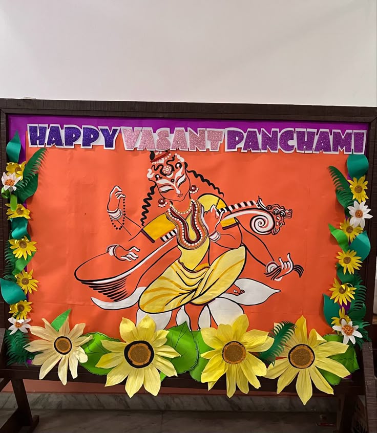 This may contain: there is a sign with flowers on it that says happy vasant panchami
