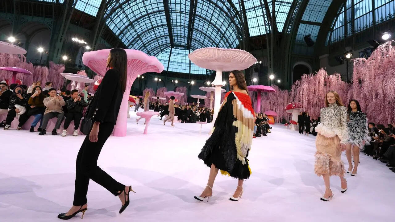 Matthieu Blazy’s first couture collection for Chanel unfolded against a surrealist set of sugar-pink trees and giant toadstools. (Photo: AP)
