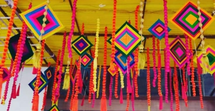 This may contain: colorful decorations are hanging from the ceiling