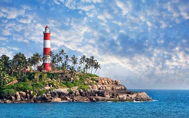 This may contain: an island with a light house on it