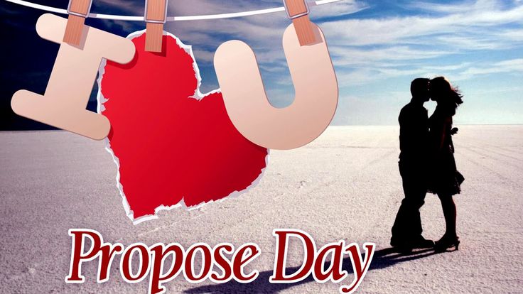 This may contain: a man and woman kissing in front of a red heart on a clothes line with the word proposed purpose day written below them