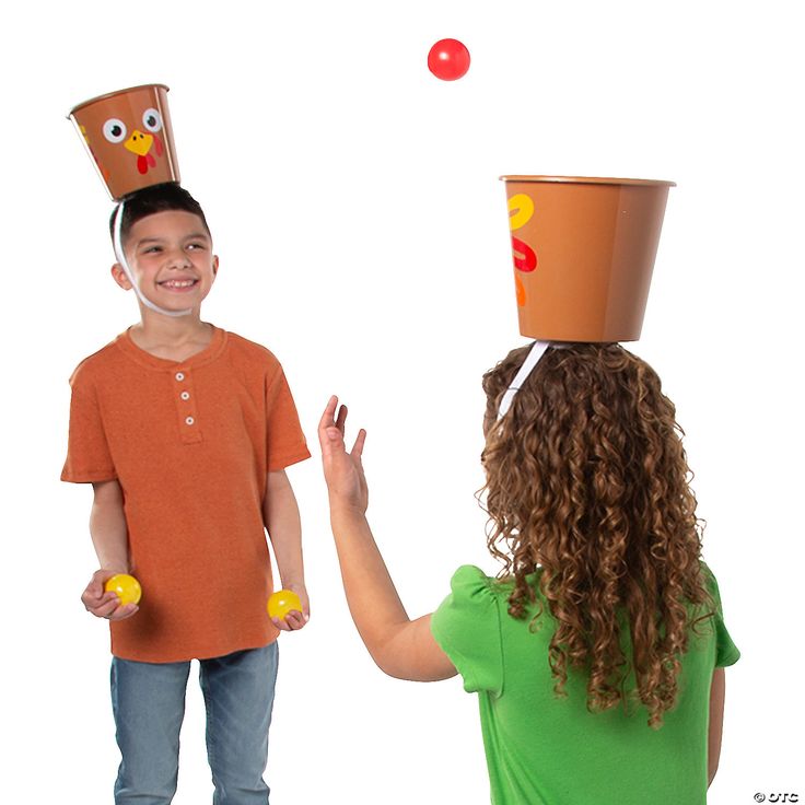 This may contain: two children are playing with an owl hat on top of each other's head