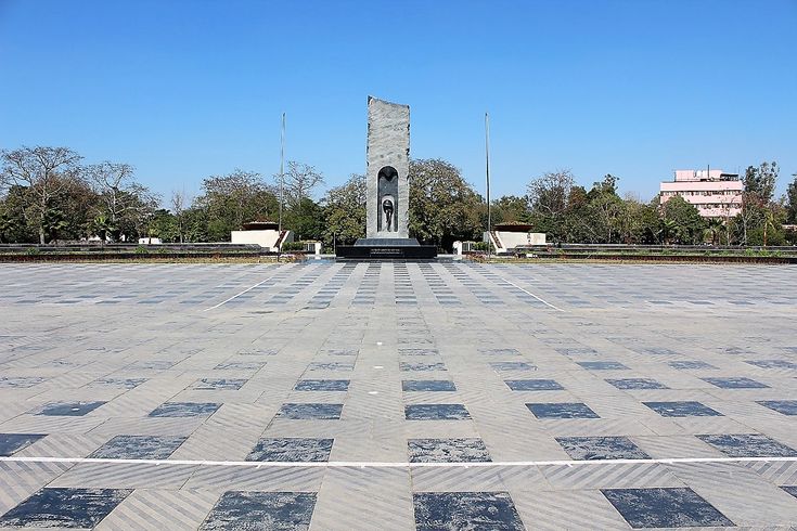 This may contain: an empty square with a monument in the middle