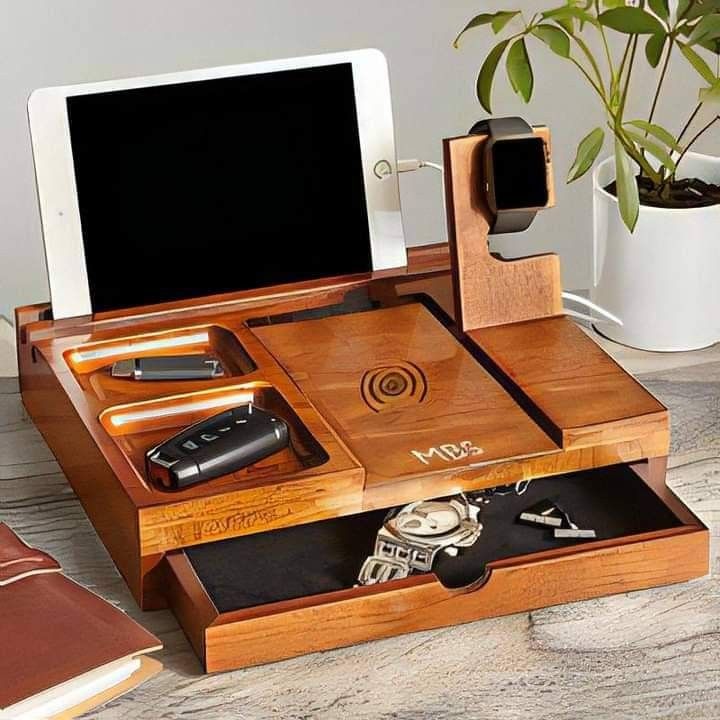 This may contain: a wooden desk with an electronic device, watch and keys in the drawer next to it