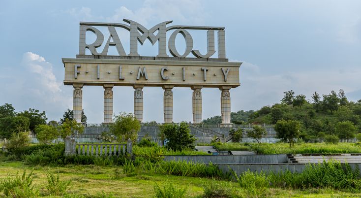 This may contain: a large sign that reads rambo plant city in front of some bushes and trees