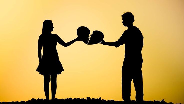 This may contain: a man and woman holding tennis racquets in front of an orange sky