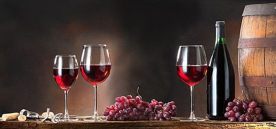 This may contain: two wine glasses and some grapes on a table