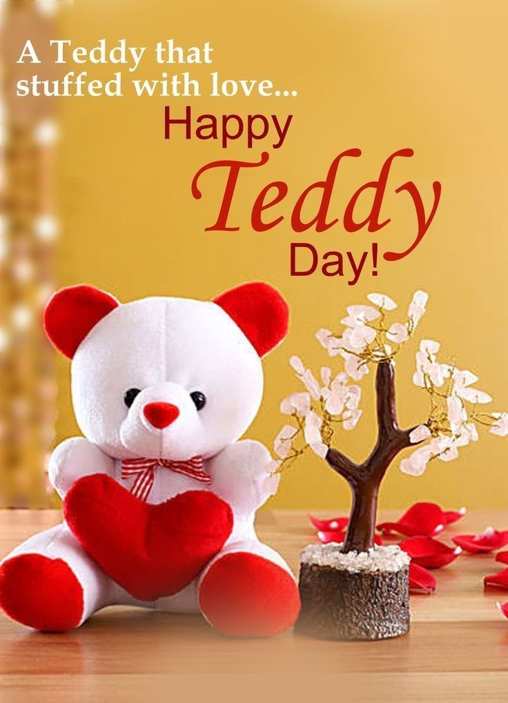 This may contain: a teddy bear holding a heart sitting next to a small tree with petals on it