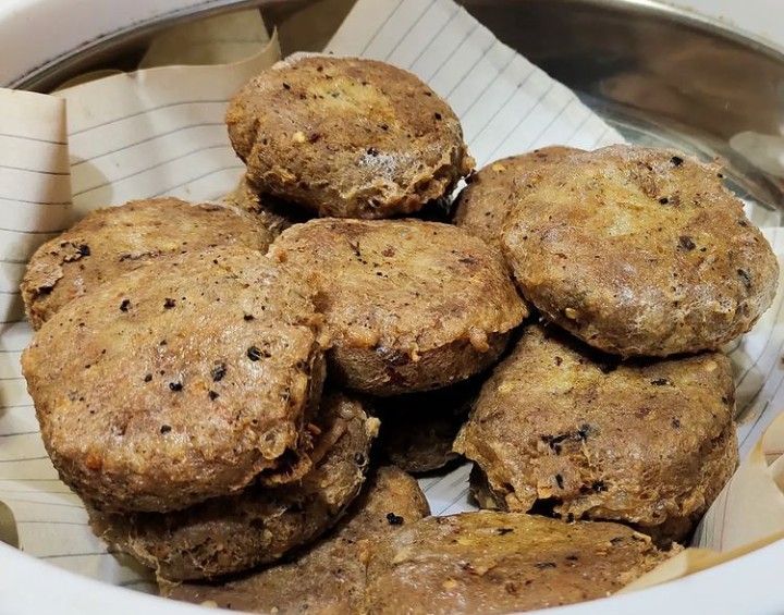 This may contain: a bowl filled with cookies sitting on top of a table
