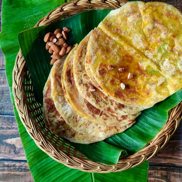 This contains: Holige, puran poli, badam holige, South Indian sweet paratha