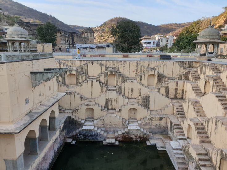 This may contain: an old building that has been built into the water