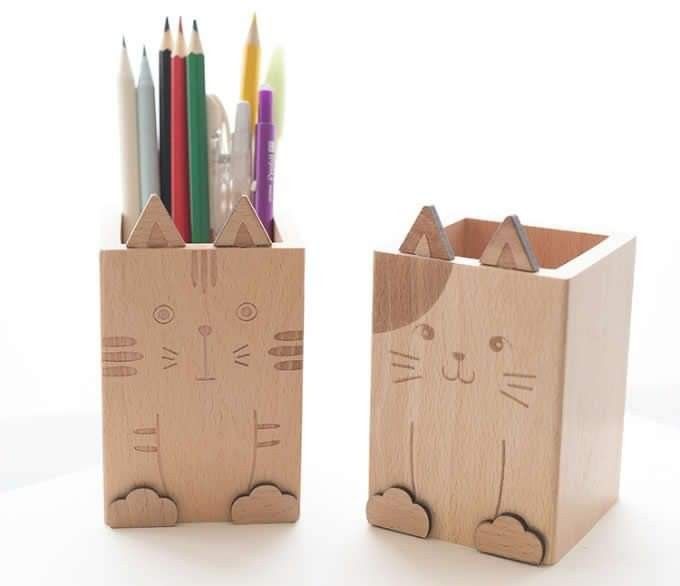 This may contain: two wooden pencil holders with cats on them